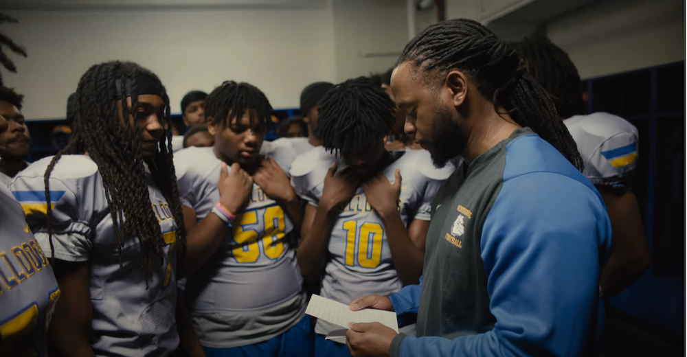 Westinghouse Academy football team receiving a grant.