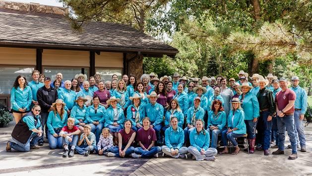 A large group photo of people outdoors