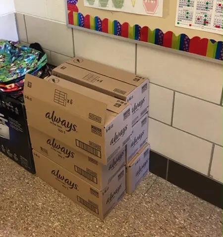 stacks of boxes marked "always" in a school room