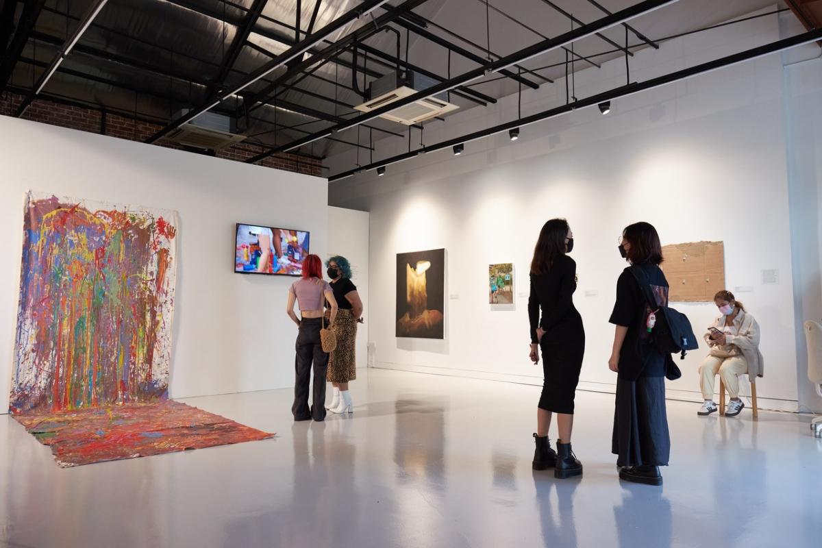 an art gallery with attendees