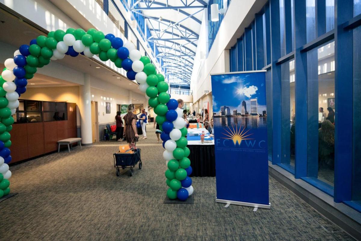 A balloon arch at the entrance of a building.