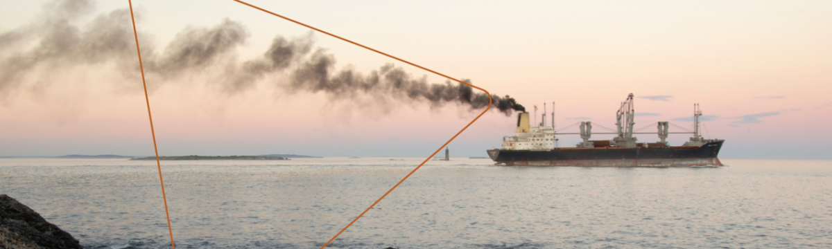 Ship with dark gray smoke coming out of smoke stack