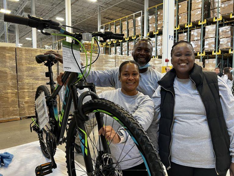 Volunteers with a bike