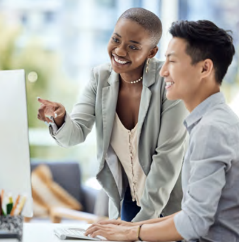 LyondellBasell employees smiling together at computer screen 