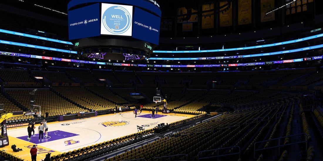 Inside the Crypto.com arena, a basketball court and stadium seating.