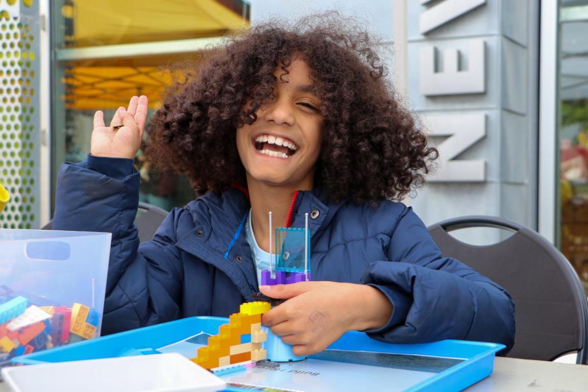 Student smiling while working on a project