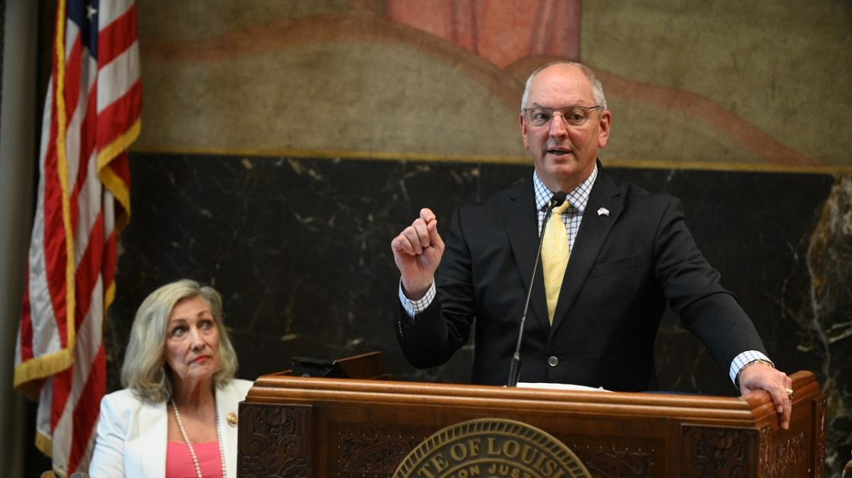 Gov. John Bel Edwards speaking at a podium