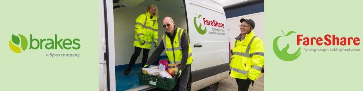 People loading crates of food onto a small truck. "FareShare" on the side.