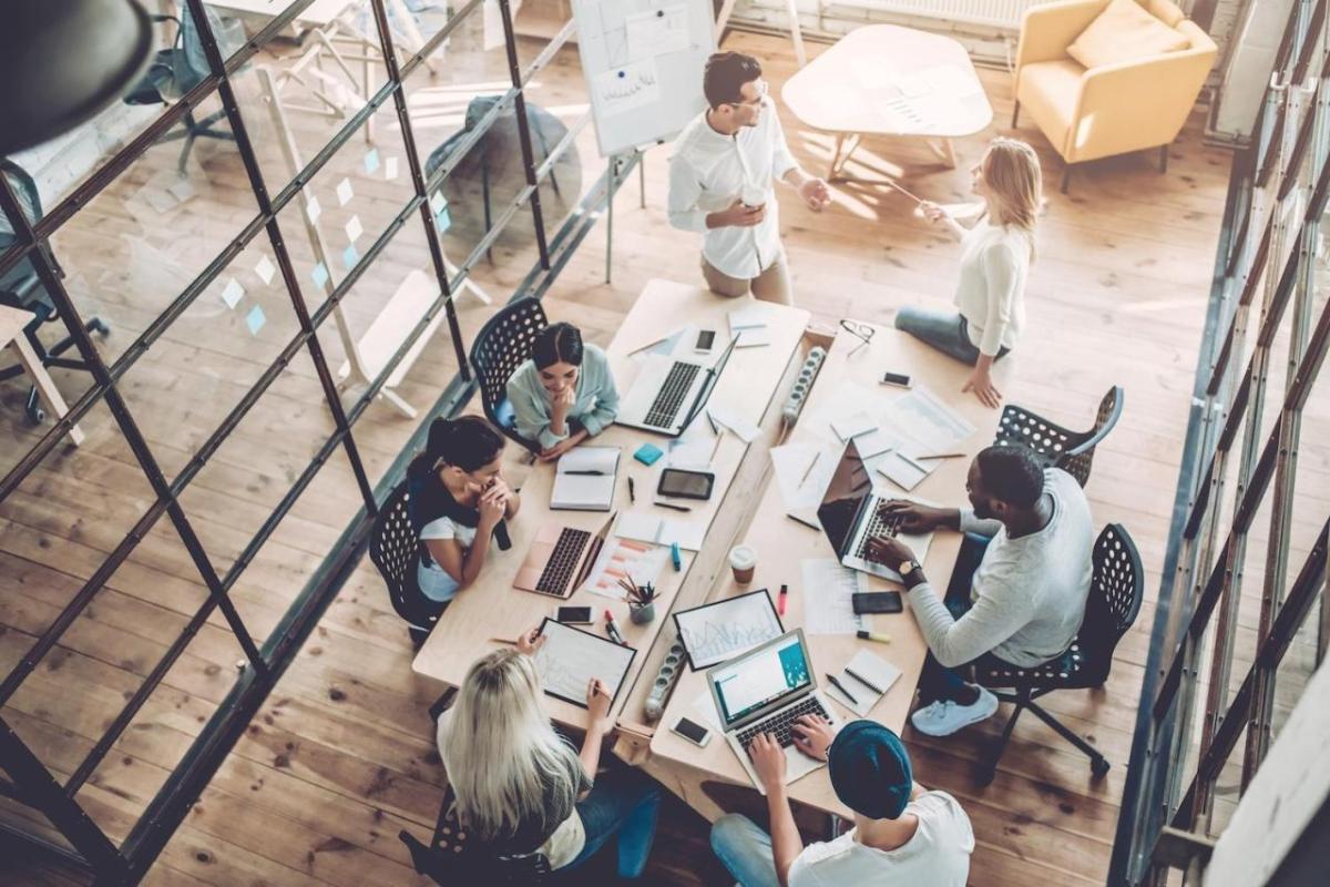 Aerial view of people working at a desk together