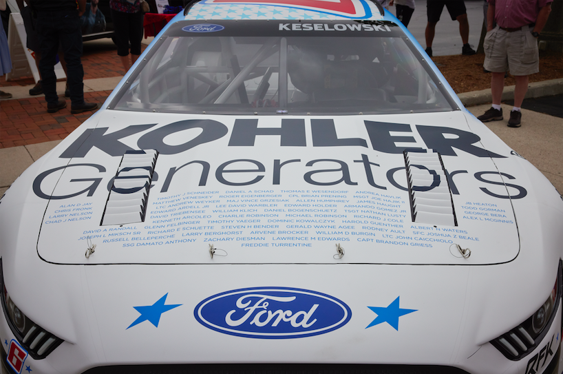 The hood of a race car, "Kohler generators" and ford logo