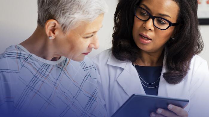 Female doctor consulting with a female patient.