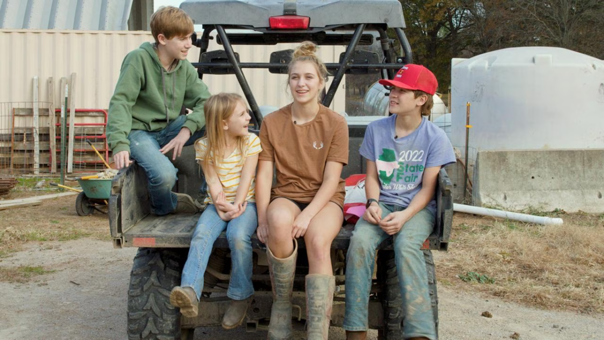 Four kids in the back of a four-wheeler