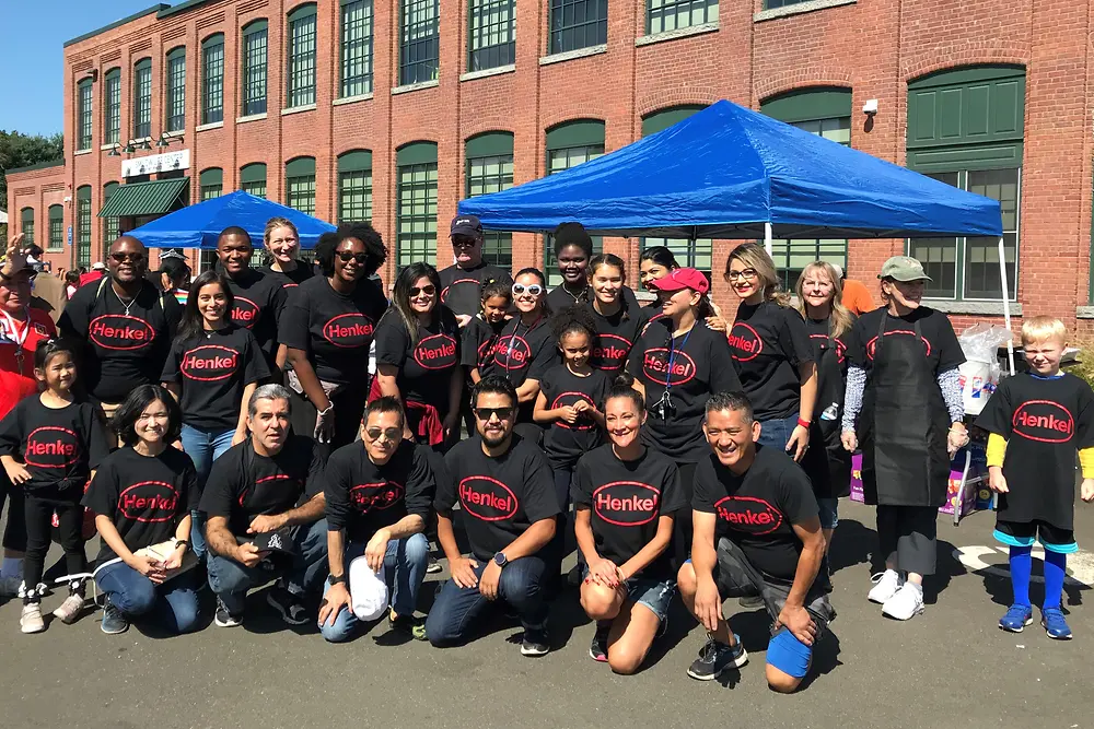 Group of people wearing Henkel t-shirts