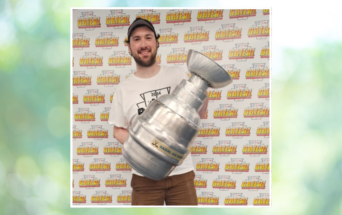 Miller with the hockey tournament’s championship cup.