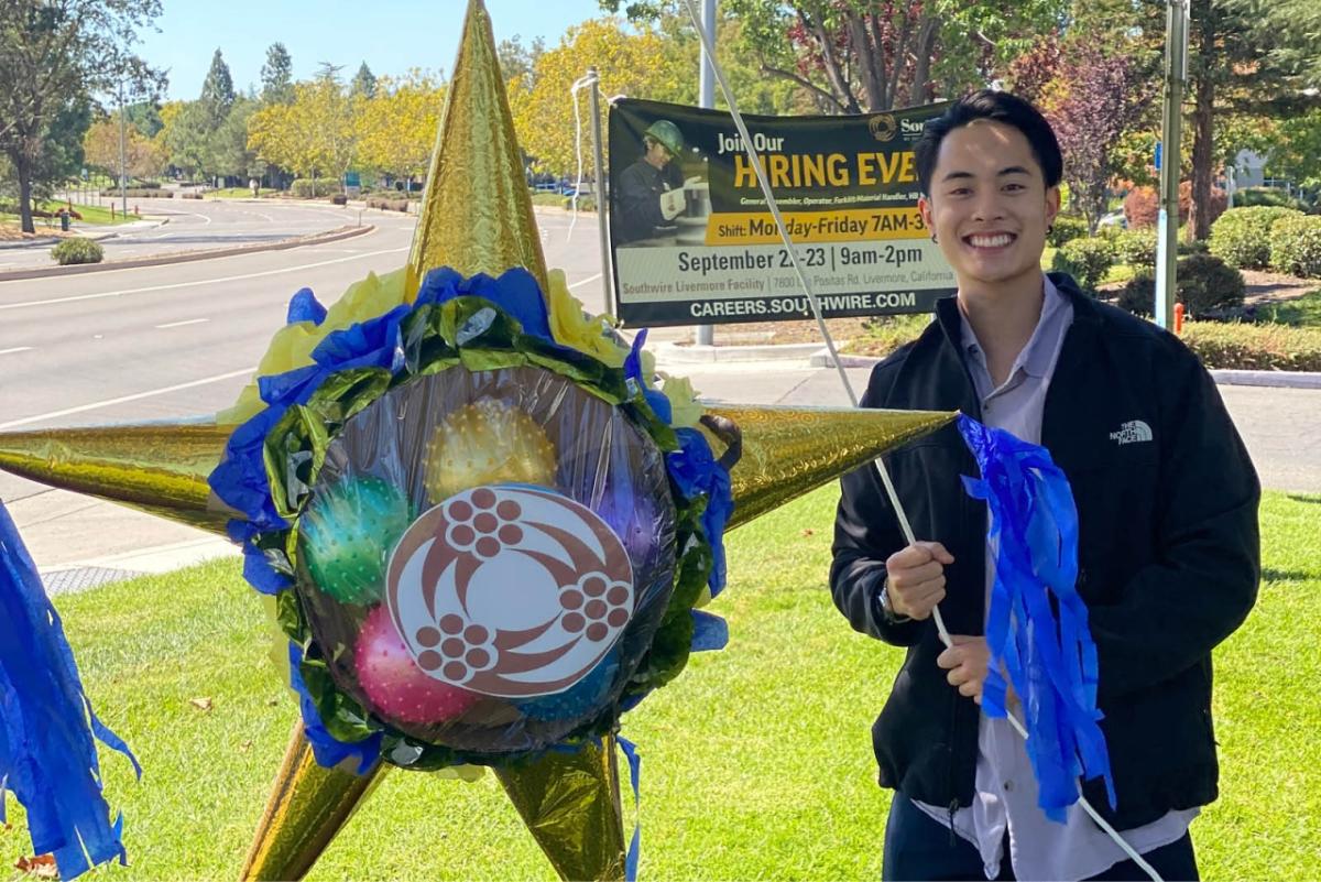 a person holding a pinata outside