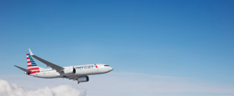 plane in flight above the clouds