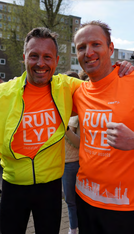 Two runners in matching shirts.