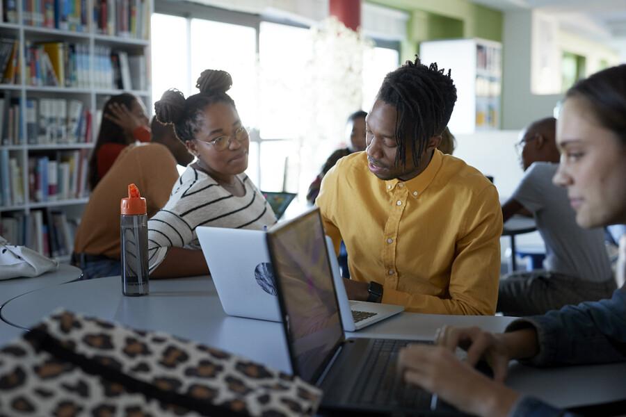 black students working on laptops