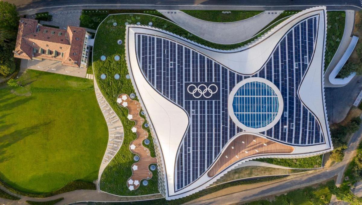 Aerial view of a rooftop covered in solar panels.