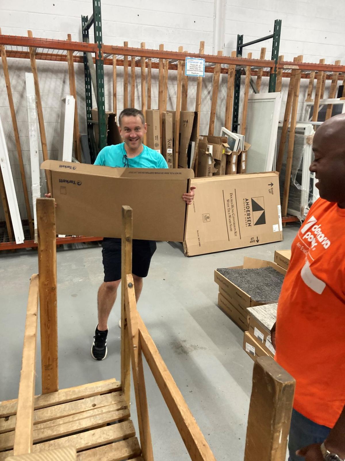 Volunteers moving boxes in the store.