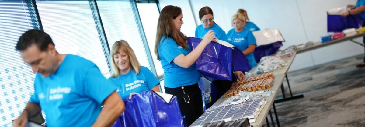 Duke Energy employee volunteers packing Storm kits 