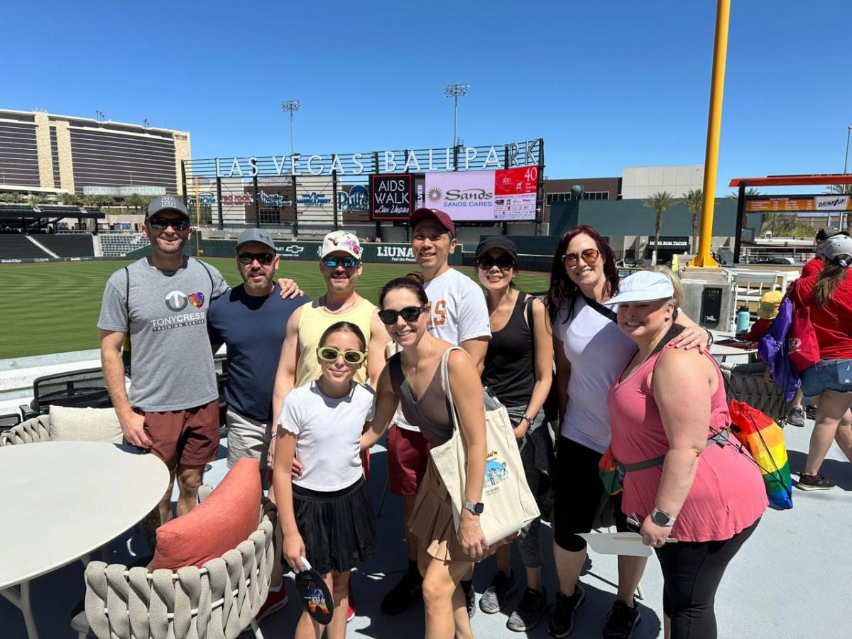 A team posed at a baseball event.