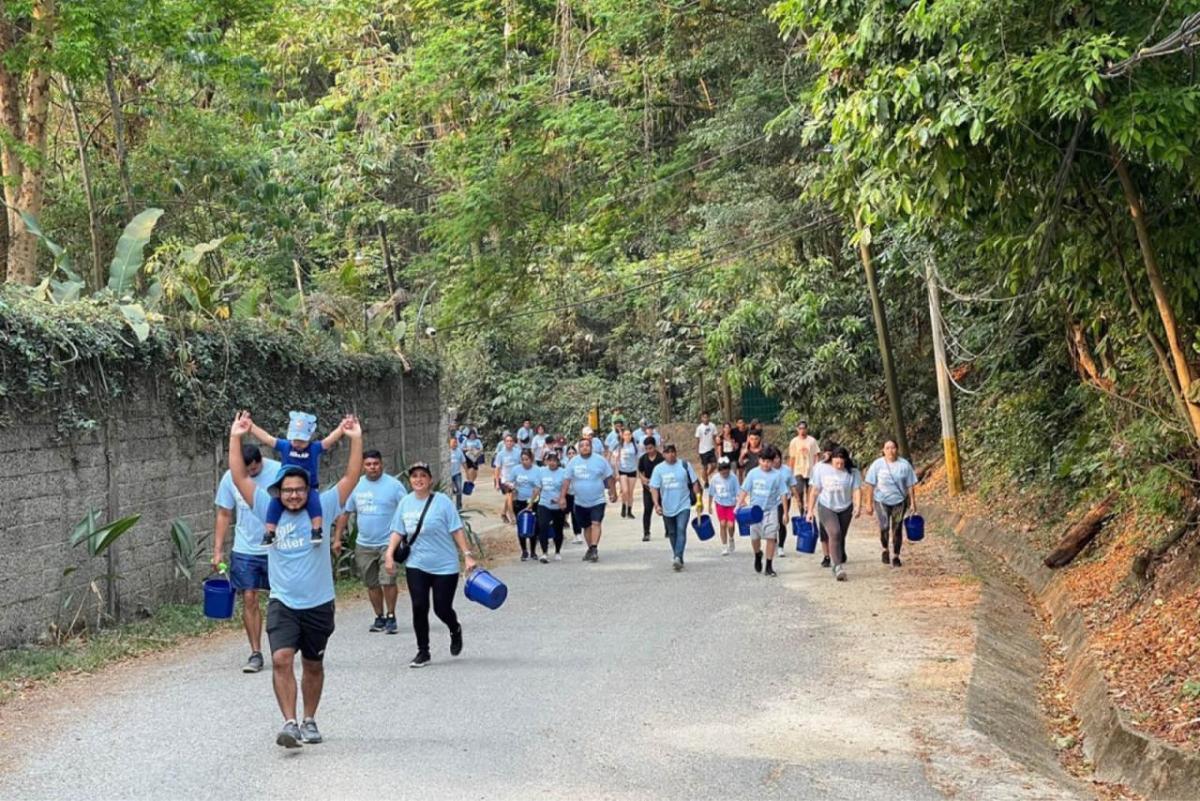 Participants walking the Walk for Water event up hill